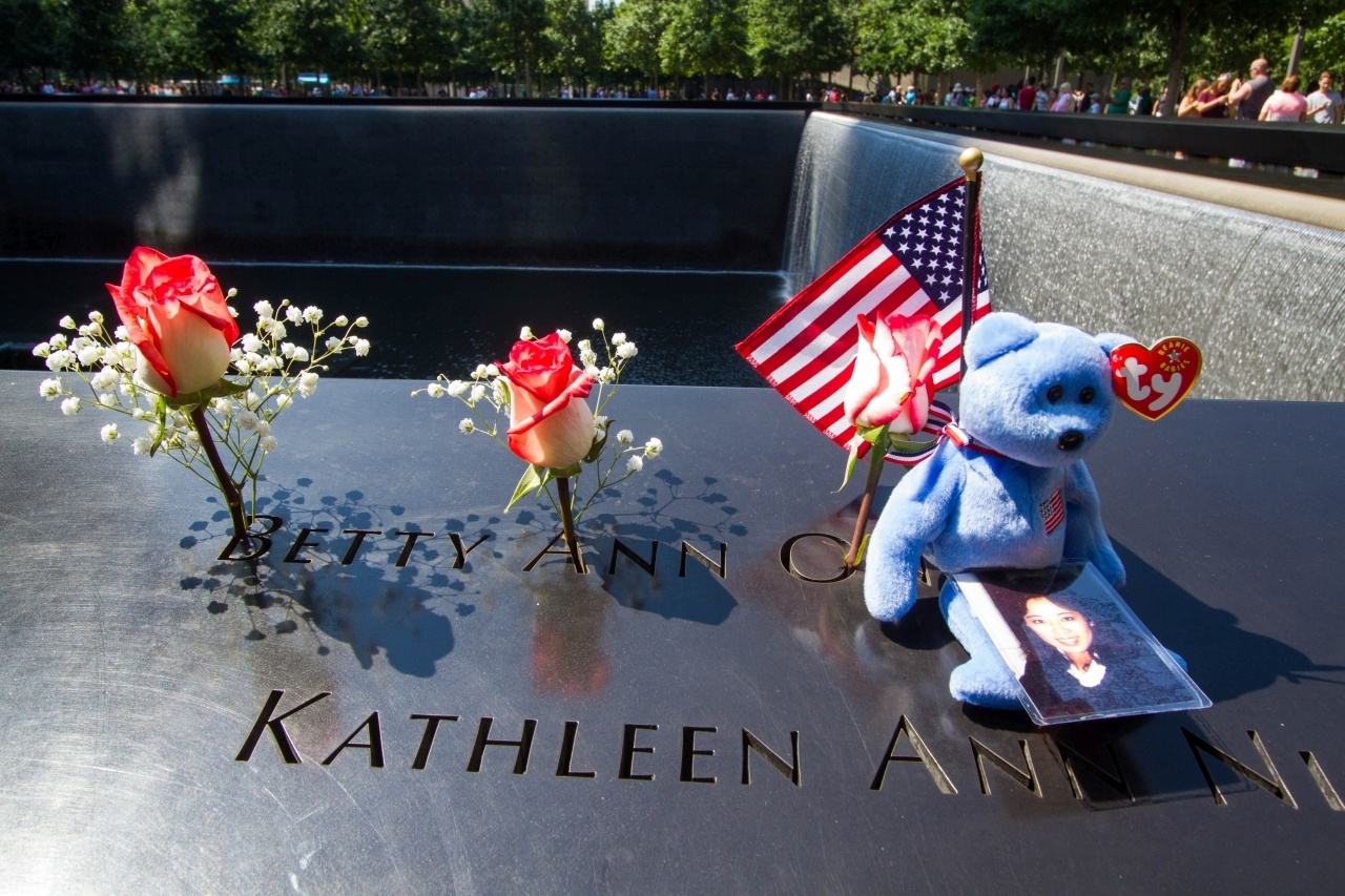 Family members often place mementos on the name plaques at the September 11 Memorial.