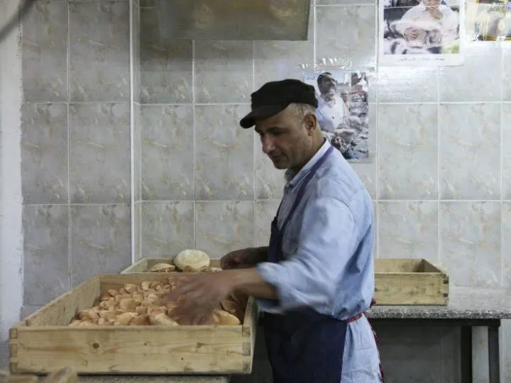 A baker making Jordanian flatbread.