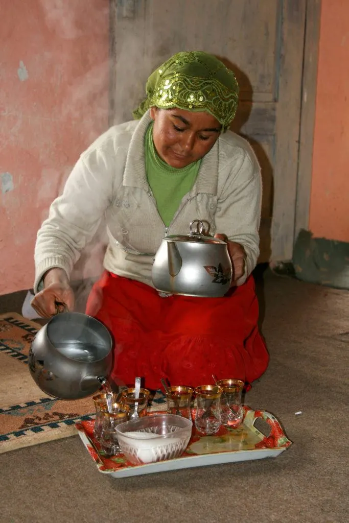 Young Turkish woman making tea.
