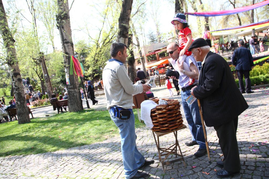 A simit vendor selling to locals.