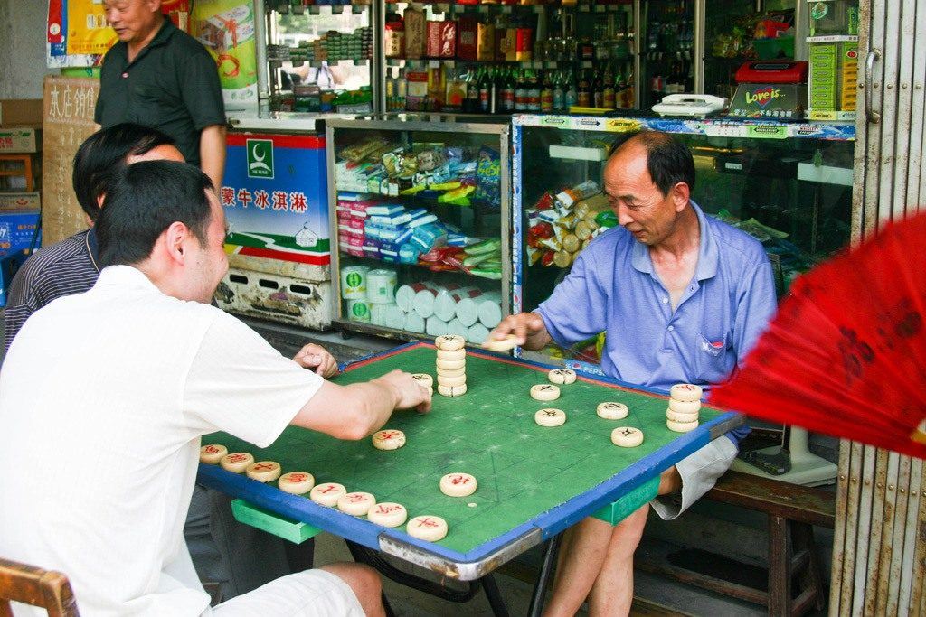 One of the reasons we love Xian, the people! These men were playing a game and invited us to watch. It may not be a Xian tourist attraction, but it is one of our best memories.