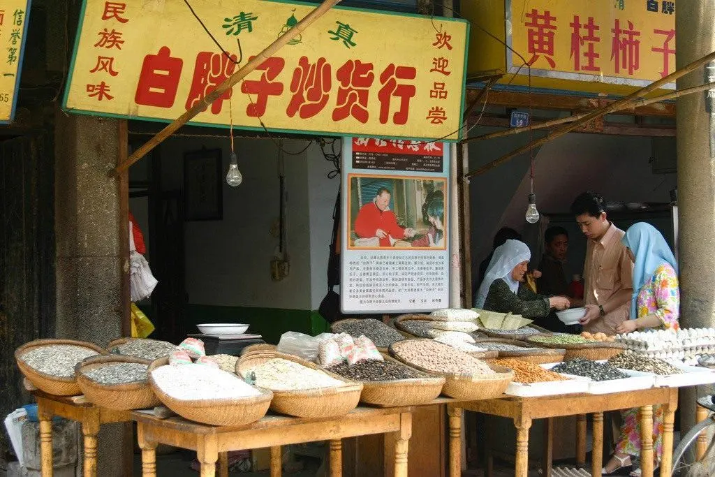 Vendors selling food and goods on the streets of the Muslim Quarter, one of the best places to visit in Xian.