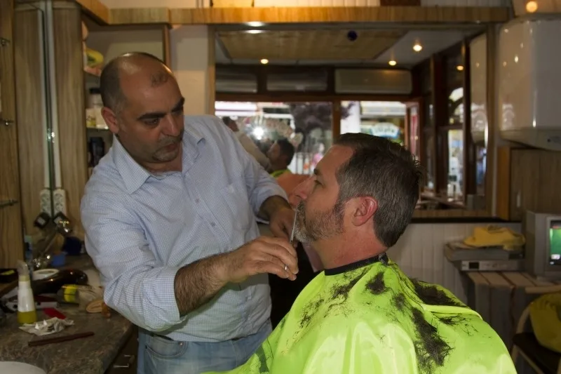 Turkish Barber trimming the beard.