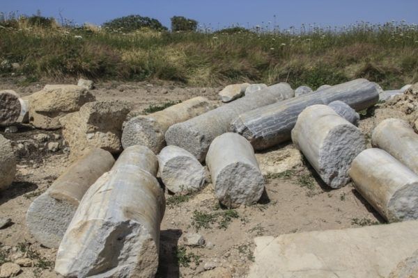 Broken marble pillars lay on the ground at Caesarea.