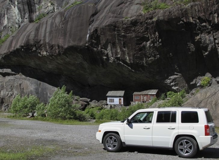 Our white jeep on the road in southern Norway for a great road trip.
