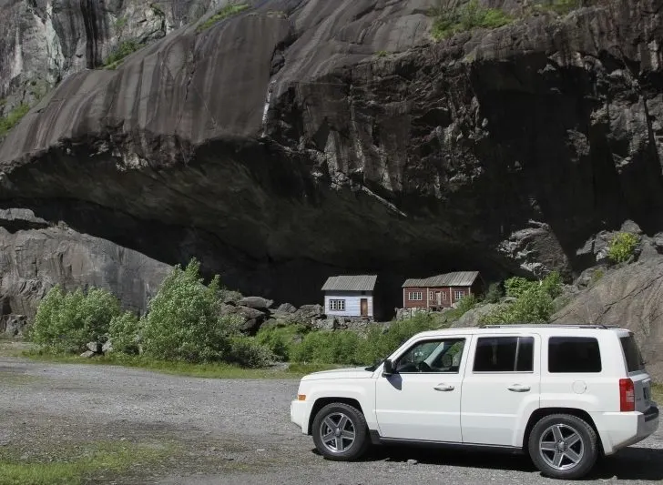 Our white jeep on the road in southern Norway for a great road trip.