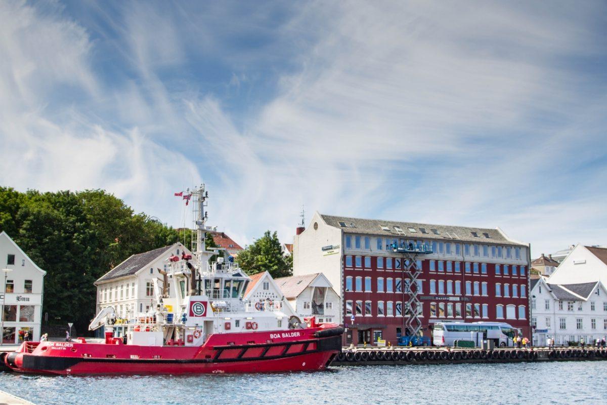A red boat docked in Stavanger, Norway.