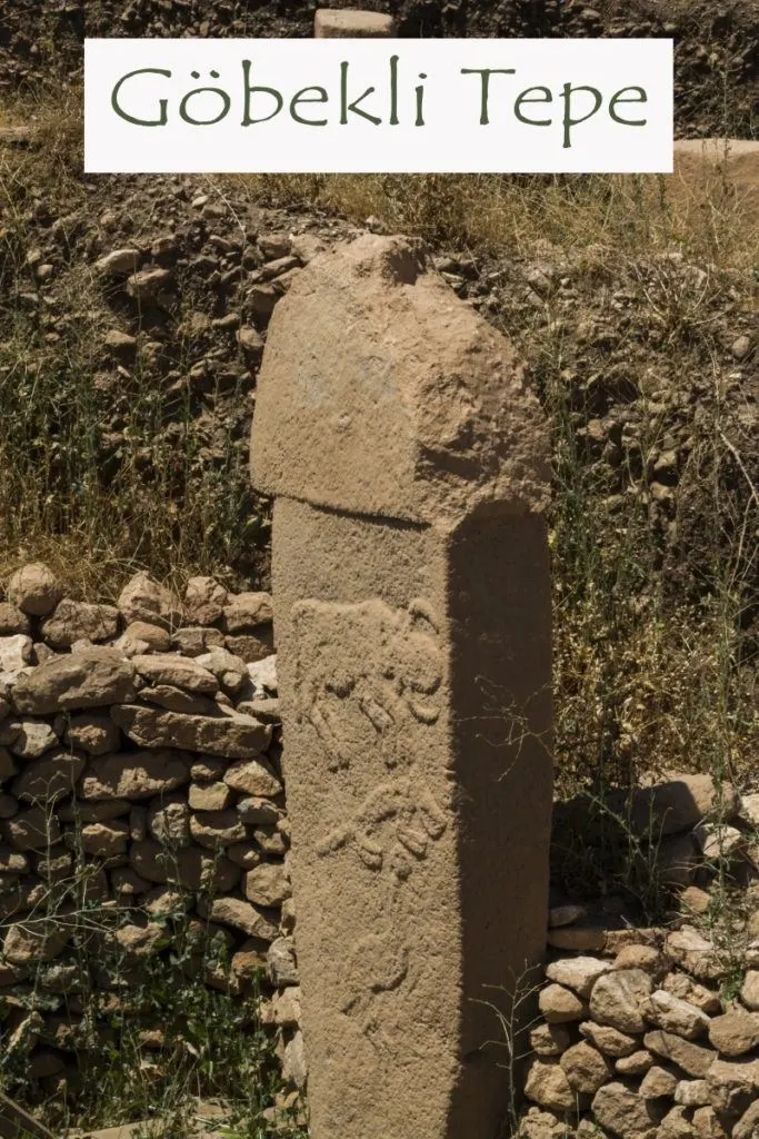 Gobekli Tepe standing stone with animal reliefs carved i n the face.