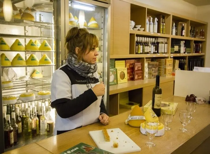 Inside a shop selling Tetilla Cheese in Santiago de Compostela, Spain.