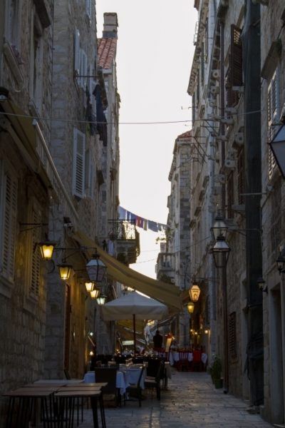 Outdoors cafe in narrow alley in Dubrovnik old town.