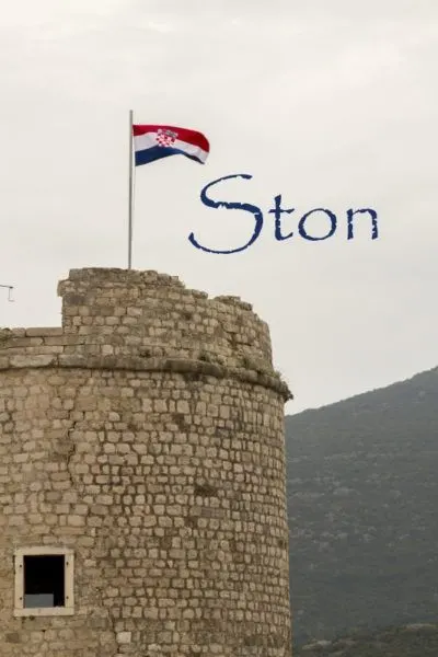 Ston defensive tower with Croatia flag flying.