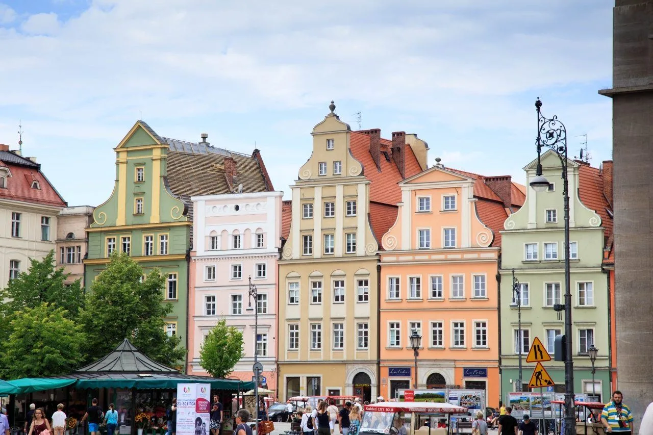 Pastel colored buildings that are reminiscent of Medieval times line the squares in the center of Wroclaw.