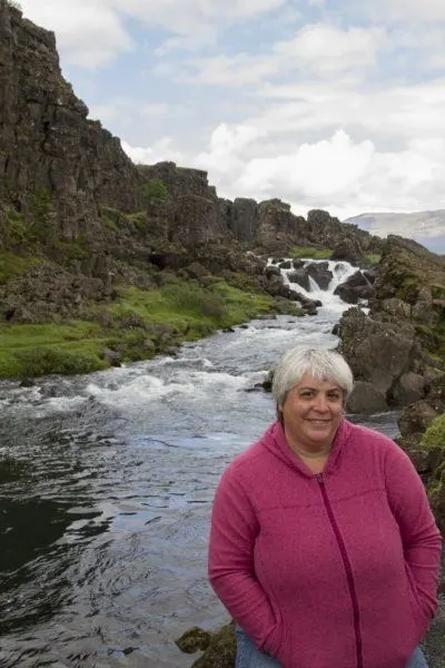 Corinne in front of a small river in Thingvellir National Park.