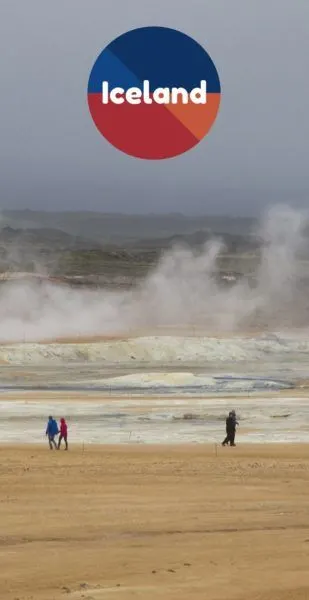 Visitors walk around sulfur pits in Iceland.