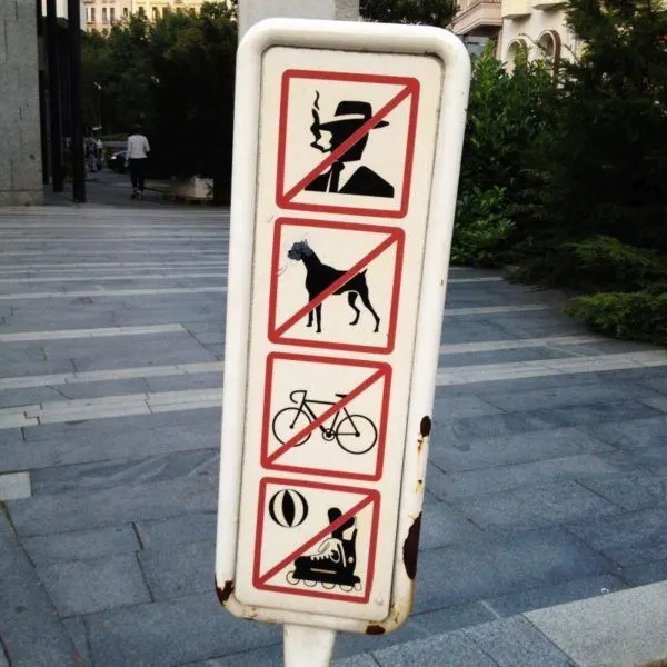 Karlovy Vary pedestrian advisory sign - no smoking, no dogs, no cycling, no skating or ball playing.