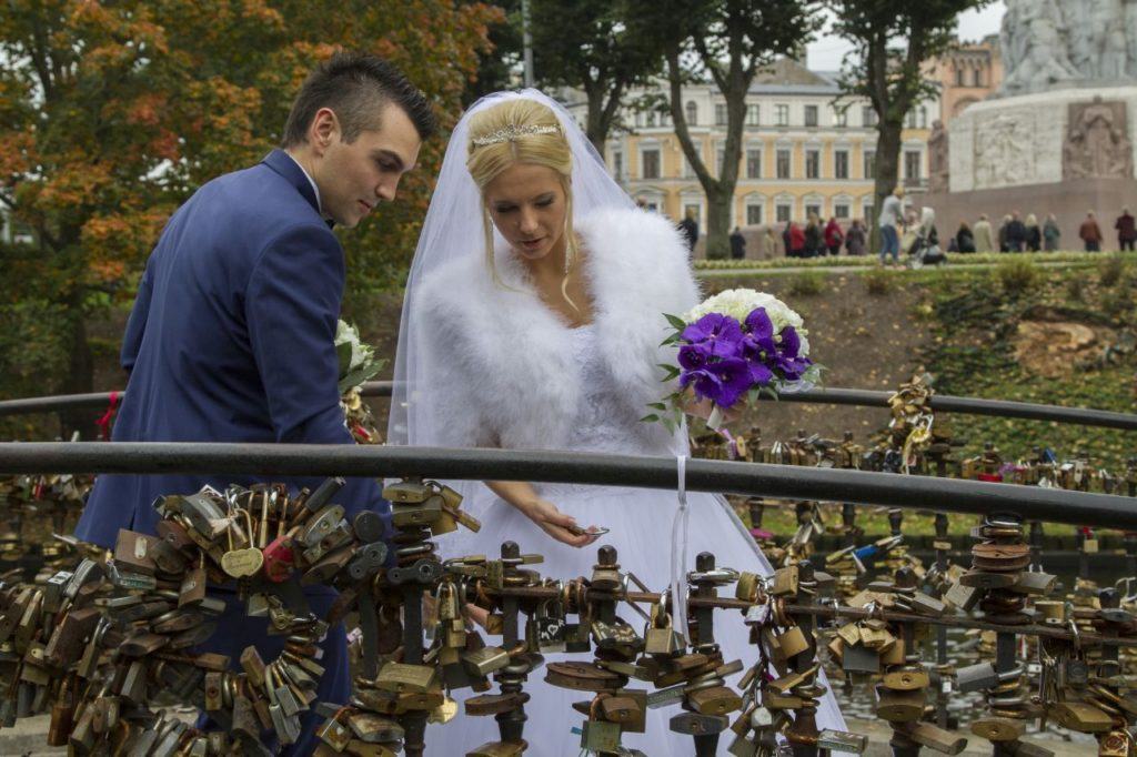 Bride and groom lock in their love in Riga, Latvia.
