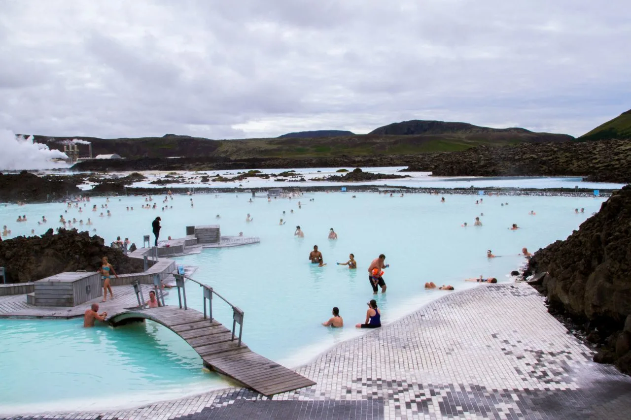 Bathers enjoy the soothing waters of the Blue Lagoon in Iceland.