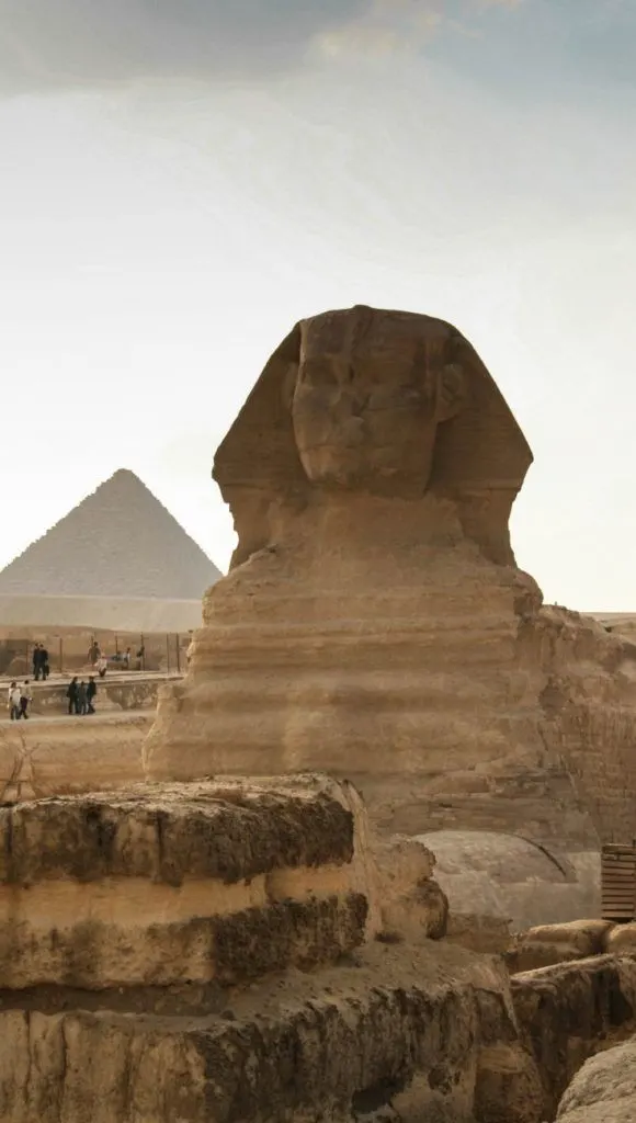 Sphinx with pyramid behind it.