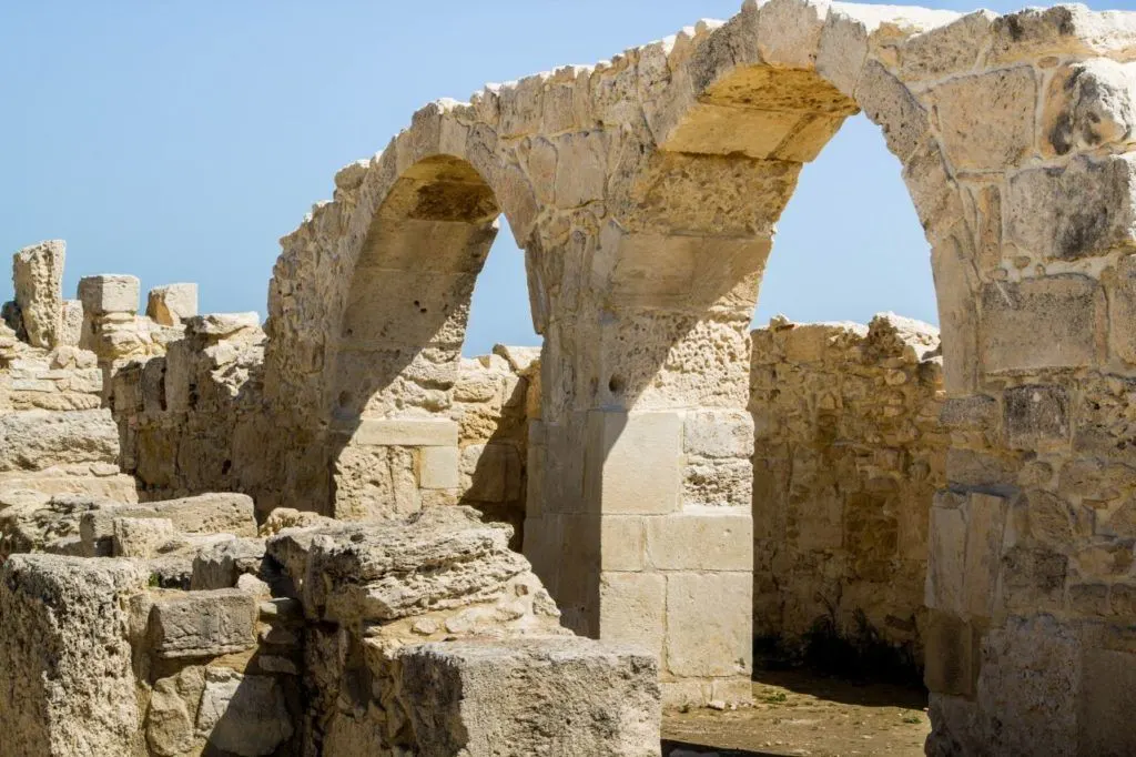 Ancient ruins of Pafos with two stone arches.