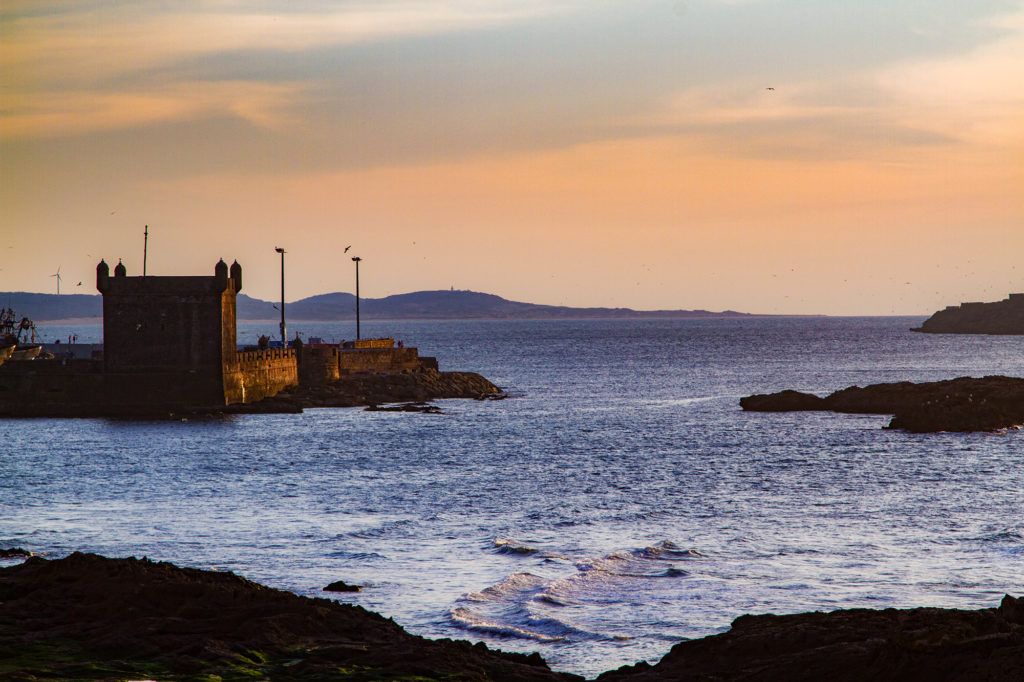 The sunsets in the Atlantic Ocean behind the Fortress in Essaouira.