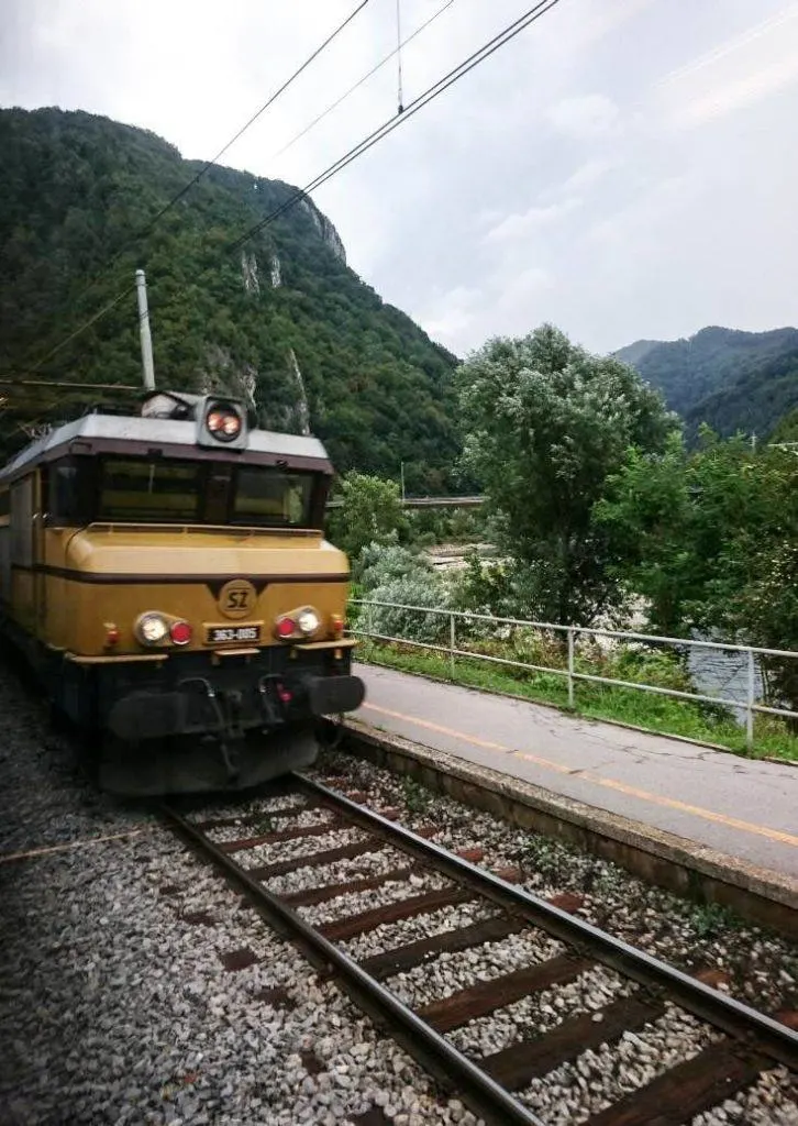 A train cruising on the tracks in Eastern Europe. 
