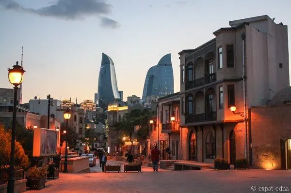 Old and new buildings in Azerbaijan at sunset.