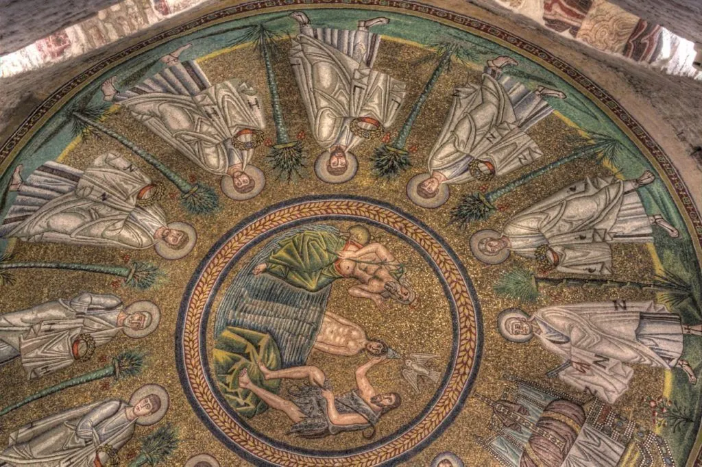 Rich mosaic of John the Baptist baptizing Christ in the Neonian Baptistry.