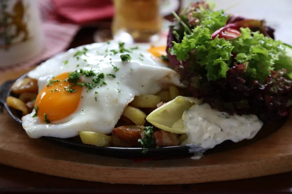 This hearty dish is a Bauernschnitzel or Farmer's Schnitzel.