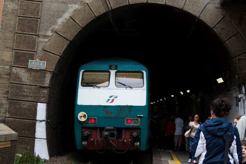 The local train stops at a Cinque Terre station.