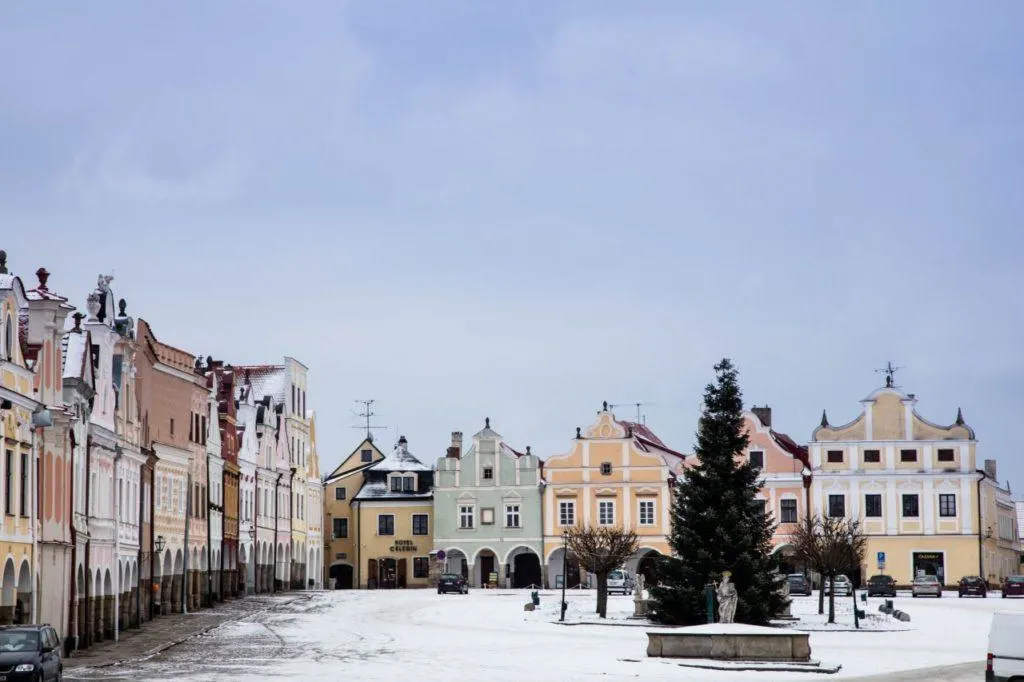 Triangular market square in Telc with Baroque and Renaissance building facades.