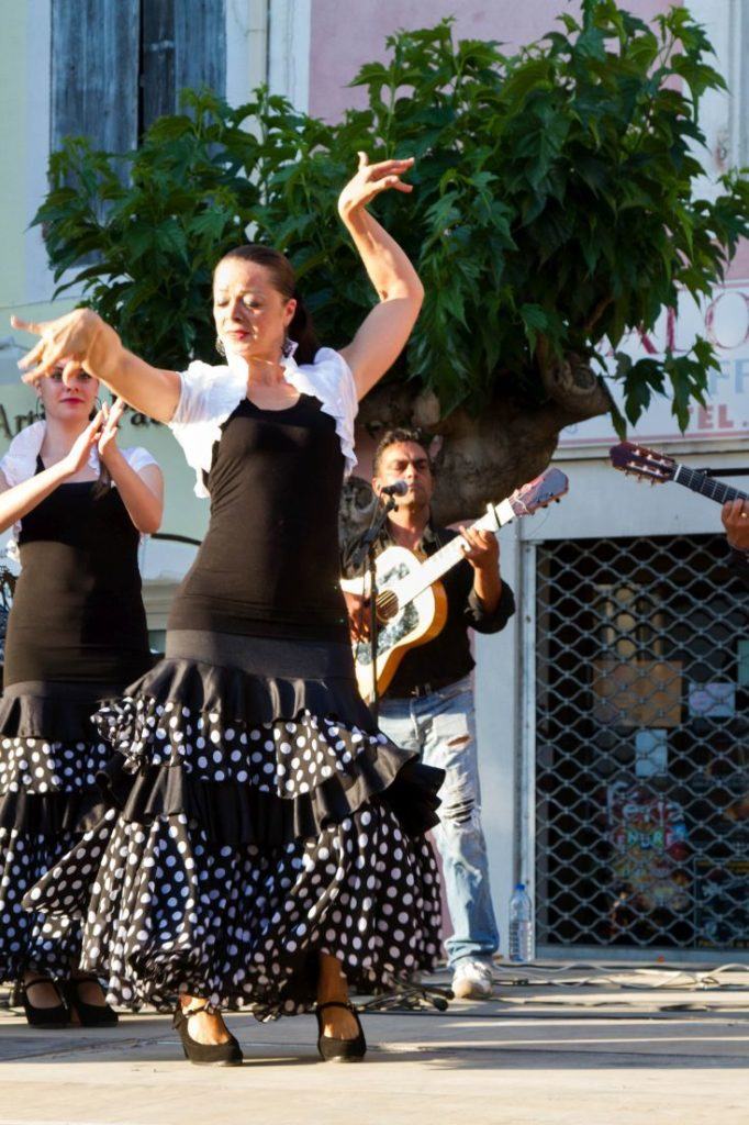 A flamenco dancer and performs on the street in Barcelona.