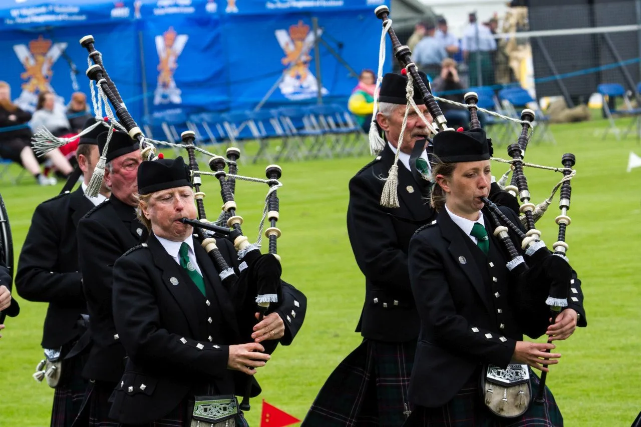 Bagpipe players, piping in the competition of the Highland Games in Inverness.