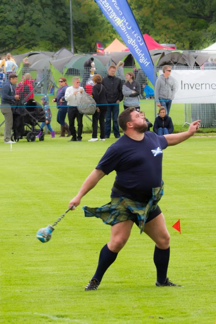 Competing hard, throwing the weight, at the Inverness Highland Games.
