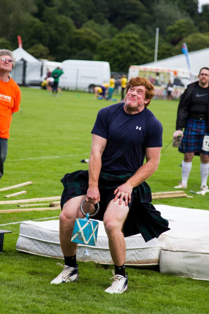 Amazing concentration on the face of this man as he heaves 56 pounds over the high bar, one of the most traditional events of the Scottish Highland Games.