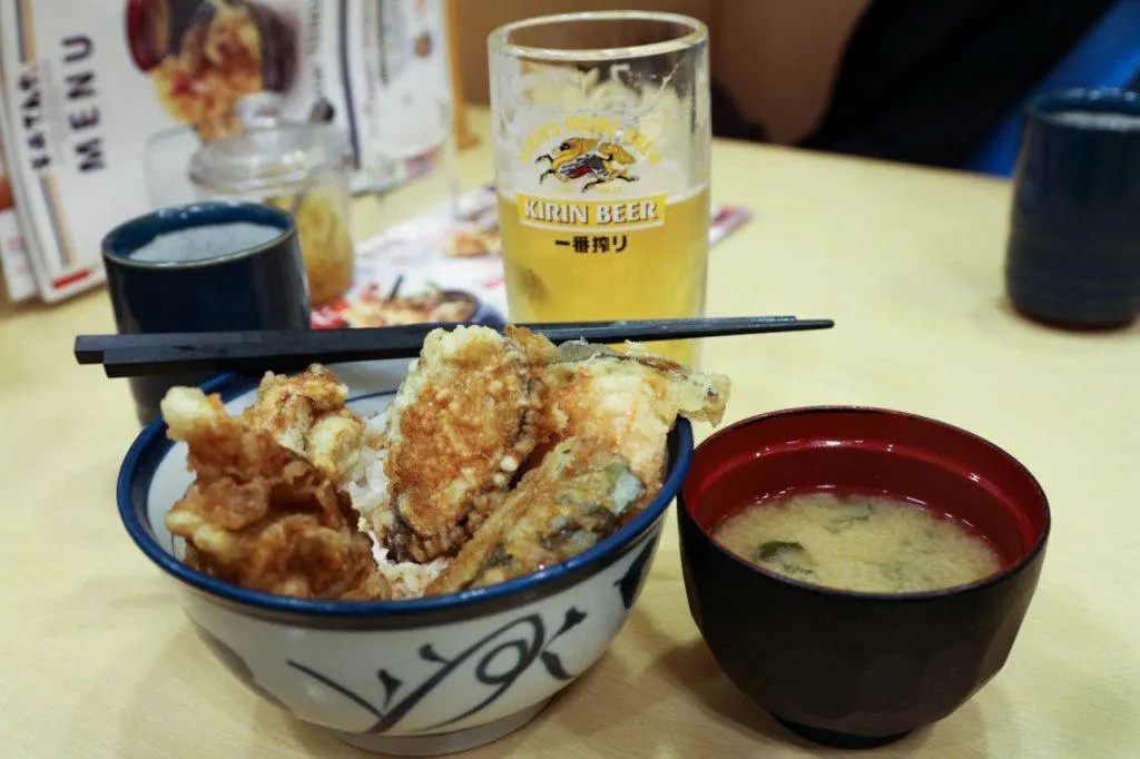 Tempura bowl, one of the most popular Japanese foods, along with Kirin beer and misu soup.