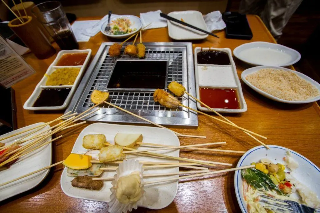 Sticks to fry any kind of Japanese food you can think of crowd the table and boiling pot.