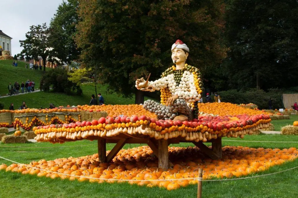 A flying carpet and man, made out of pumpkins.