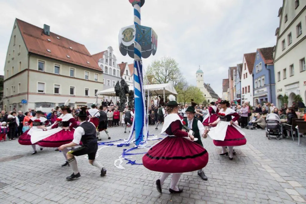 Skirts billow as dancing around the maypole is so fast and fun.