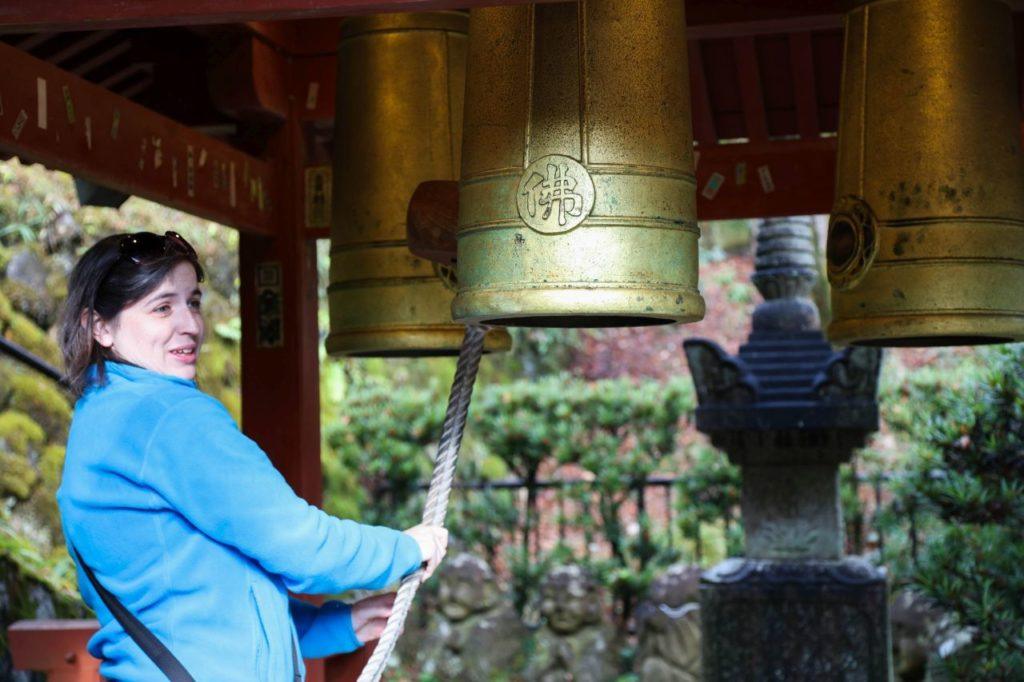 Ringing the bell at the temple.