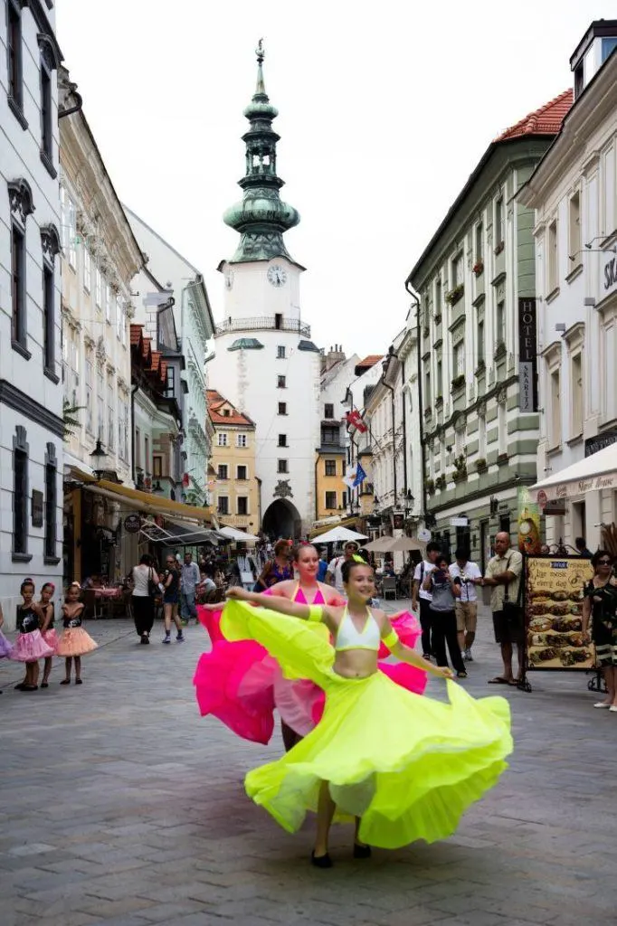 Colorful dancers in the pedestrian streets of Bratislava.