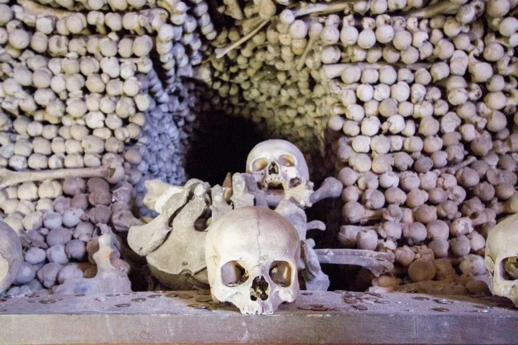 Piles of human bones and skulls in the Sedlec Bone Church a ghostly destination in Kutna Hora.