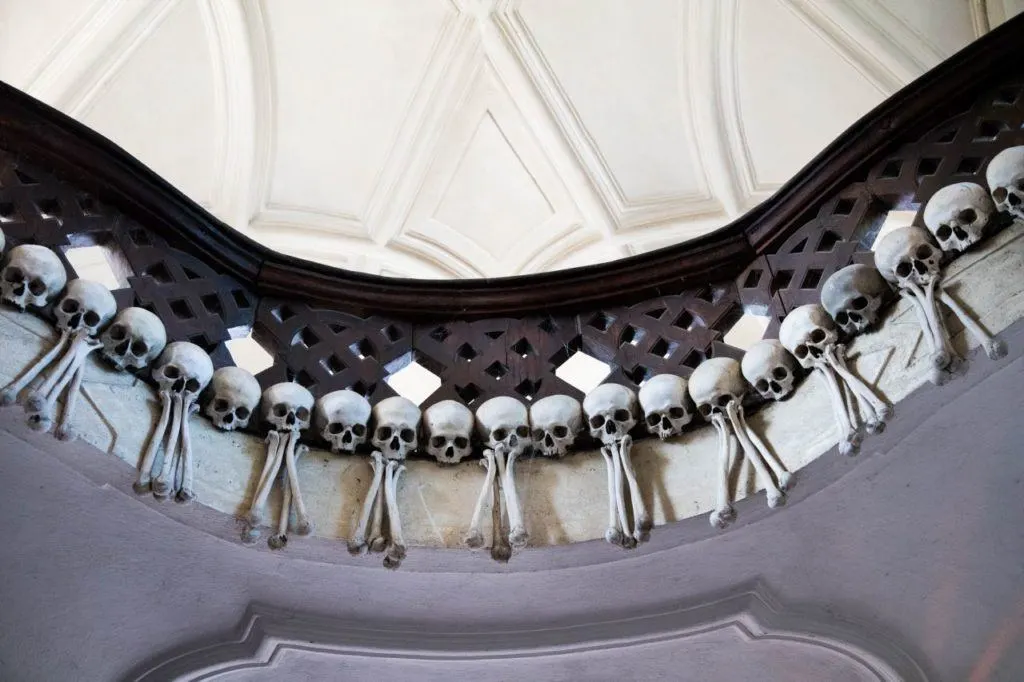 Skulls and bones decorate a balcony at the Sedlec Bone Church.