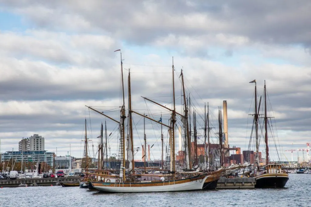 Sailboats and tall ships moored in the harbor in Helsinki, Finland. 