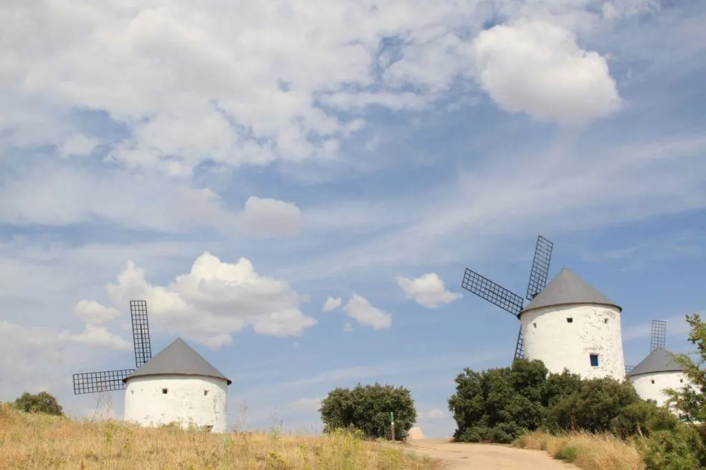 White washed windmills shining in the Spanish sun.