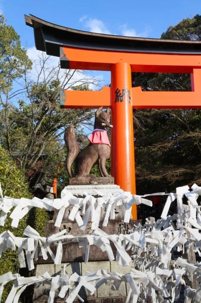 A Fox protects the entrance to  Fushimi Inari Shrine in Kyoto.