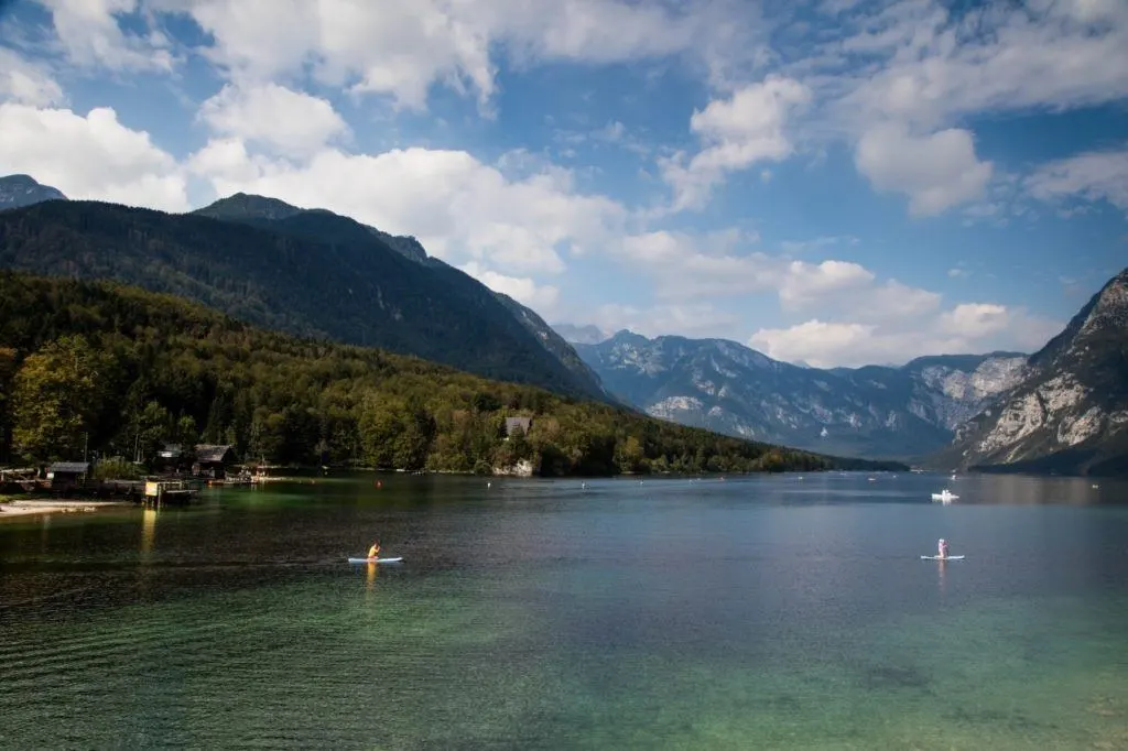 Paddle boarders on Lake Bohinj, Slovenia.