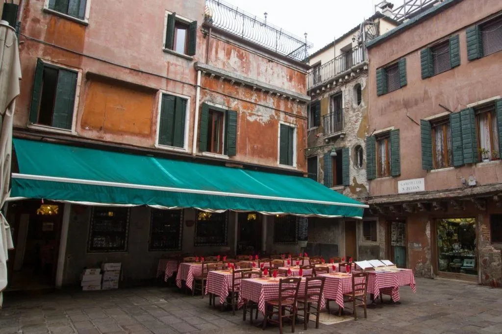 Quiet corner of Venice with outdoor restaurant.