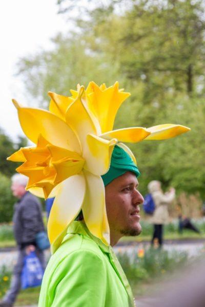 Man wearing a flower costume at the Tulip Festival parade in the Netherlands.