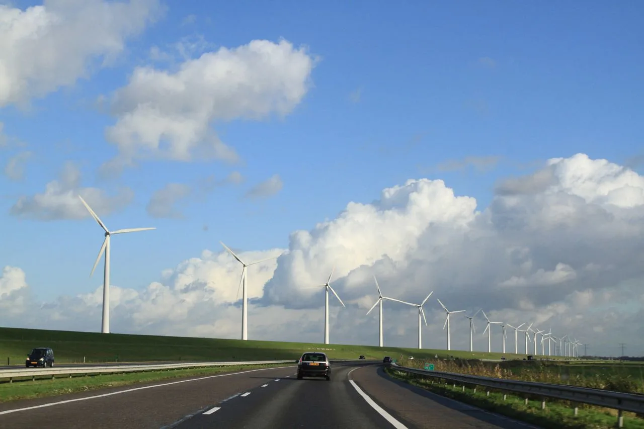 Driving past windmills under a perfect sky on the Autobahn.