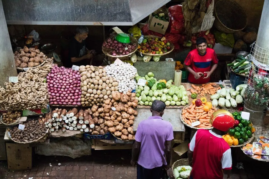 Produce Vendor in Port Louis Central Market.